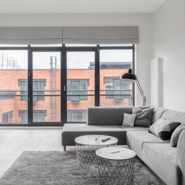 istock Bright living room with many windows 1292248731