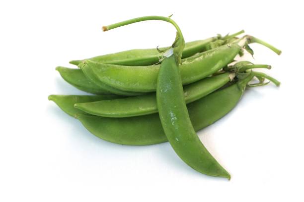 istock Organic green peas isolated on a white background. 1292249987