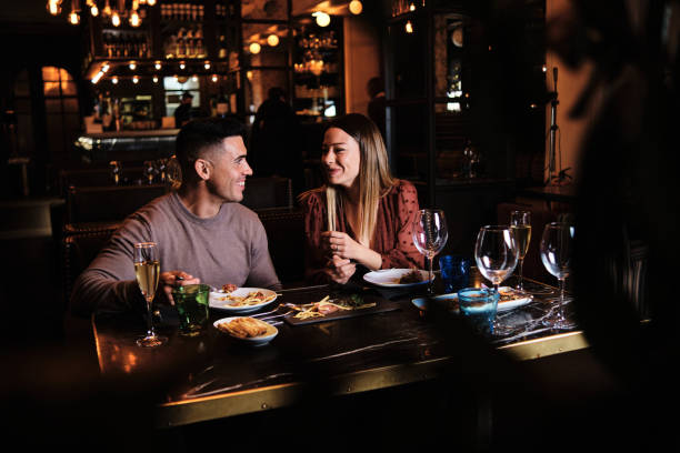 istock Young couple on a date at the restaurant. 1292252421