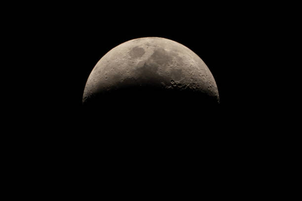istock Half moon on dark night sky background, beautiful crescent moon close up, planet on space sky by telescope view 1292252465