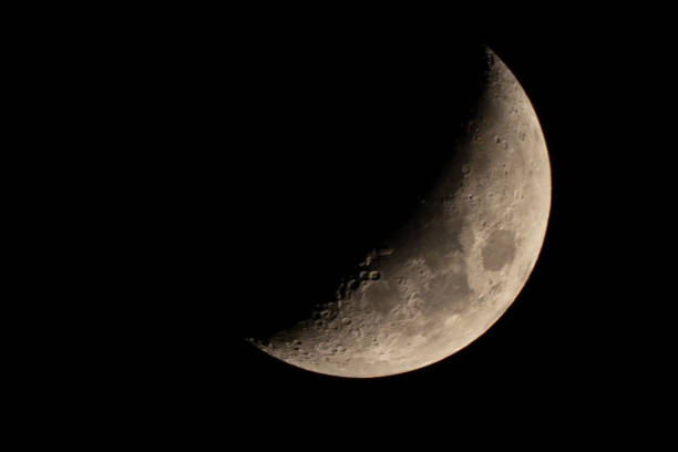 istock Half moon on dark night sky background, beautiful crescent moon close up, planet on space sky by telescope view 1292252466