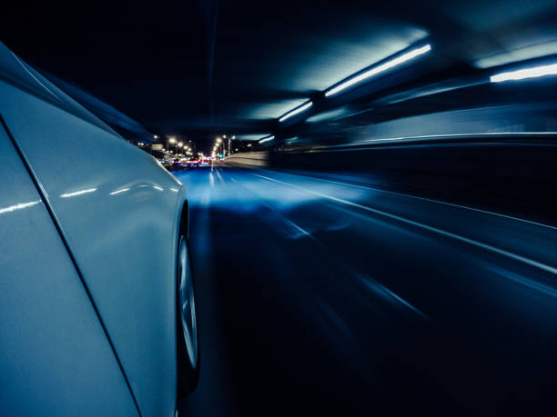 istock Car Driving on the Road at Night 1292253343