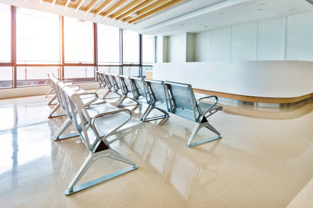 istock Empty seats in hospital waiting room 1292253567