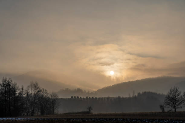 istock the sun just above the mountains with forest 1292253825