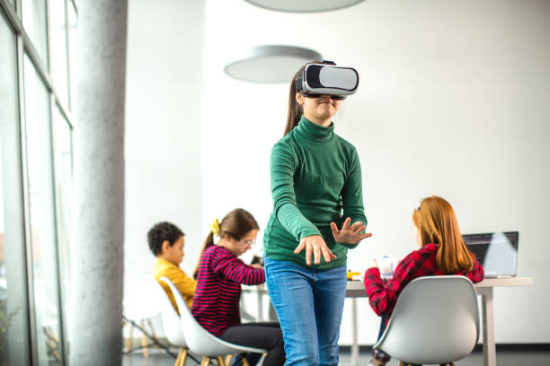 istock Kids having fun with VR glasses 1292254904