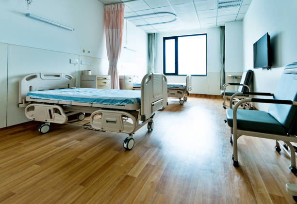 istock Hospital ward with beds and armchairs 1292256242