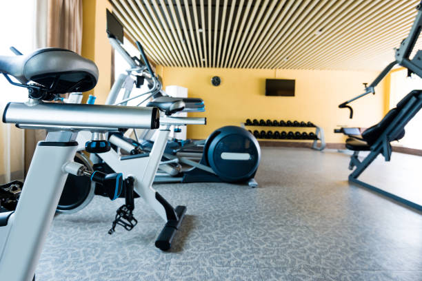 istock Group of exercise machines in gym room 1292260678
