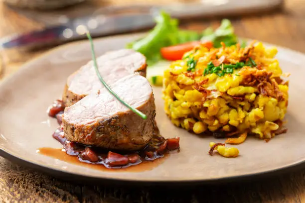 swabian pork fillet with spaetzle on wood