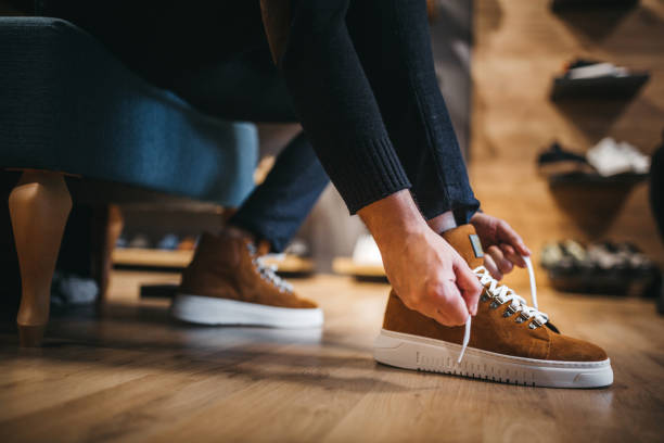 istock Young man shopping shoes 1292262041
