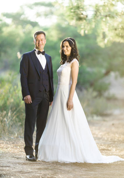 istock Beautiful bride holding groom's hands 1292262317