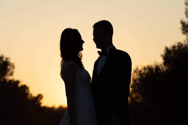 istock Married couple looking at each other on their wedding day 1292262515