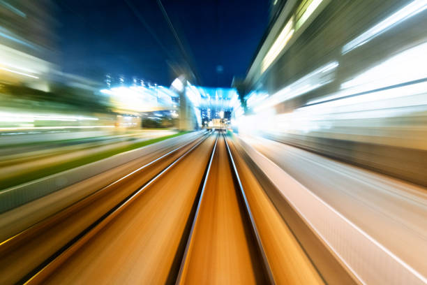 istock Motion blur railroad track in the city at night 1292264367