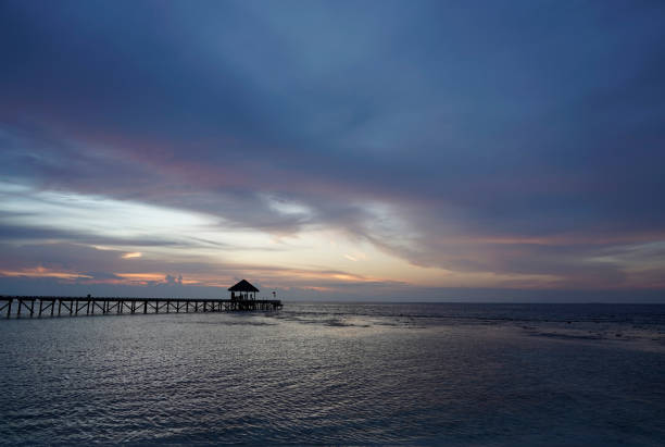 istock Sunset at the pier, cloudy evening. Maldives 1292265732