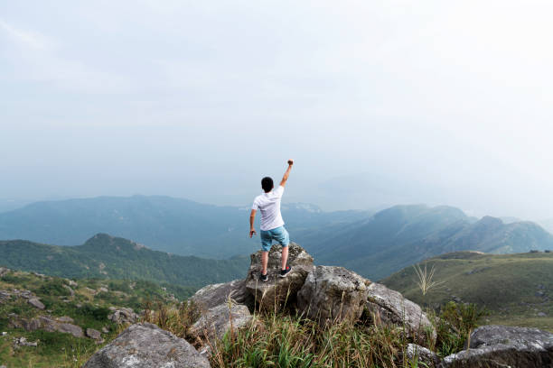 istock Man on the top of mountain 1292265803