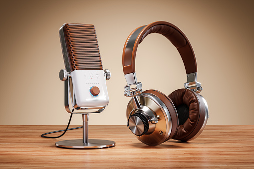 Retro microphone and headphones on table. 3D render