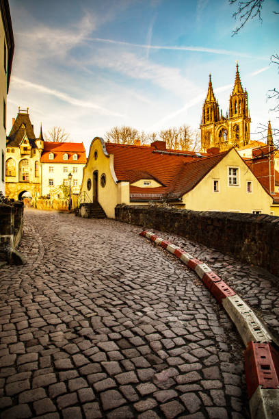 pedestrian old German street at sunset. cobblestone pavement