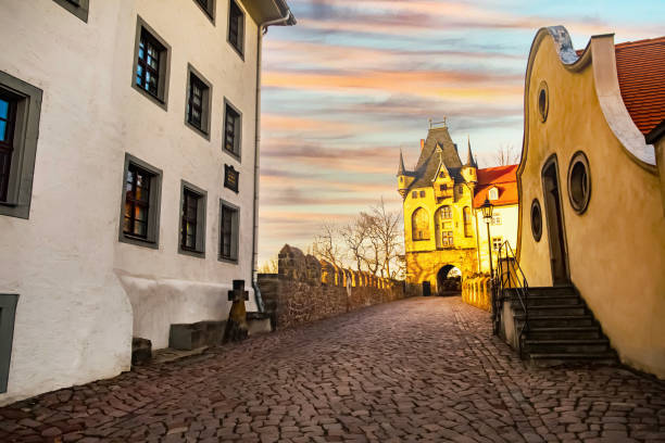 istock pedestrian old German street at sunset. cobblestone pavement