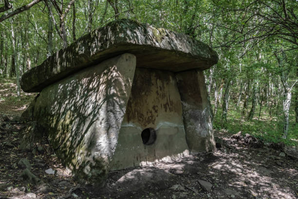 istock Stone dolmen in the thicket of a green forest 1292267727