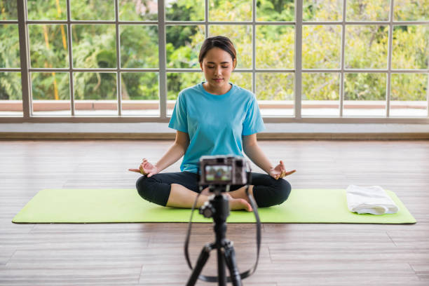 istock blogger sit in lotus position shoots video at camera 1292270065