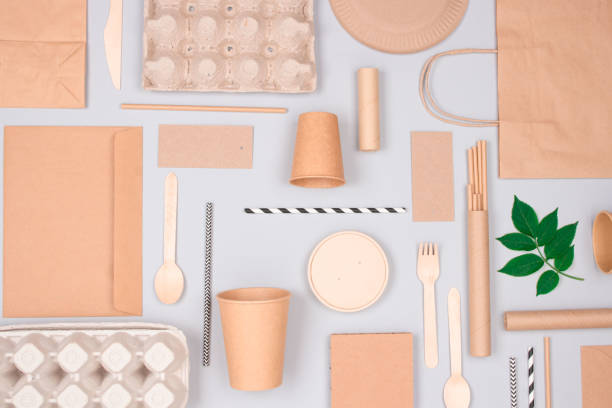 istock Flat lay composition with eco-friendly tableware - kraft paper food packaging on light gray background. Street food paper packaging - cups, plates, straws, containers and paper bags. Mockup 1292270125