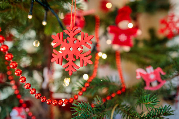 red snowflake shape handmade christmas decoration on a xmas tree