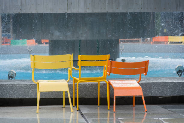 Colorful wet chairs, next to Dizengoff Square Fountain, Tel aviv, Israel stock photo