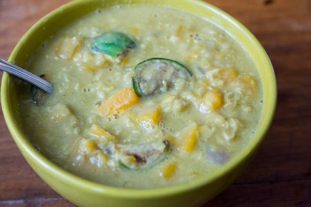 istock Asian Lentils and Butternut squash soup, with Thai eggplants, served in a green bowl 1292271739