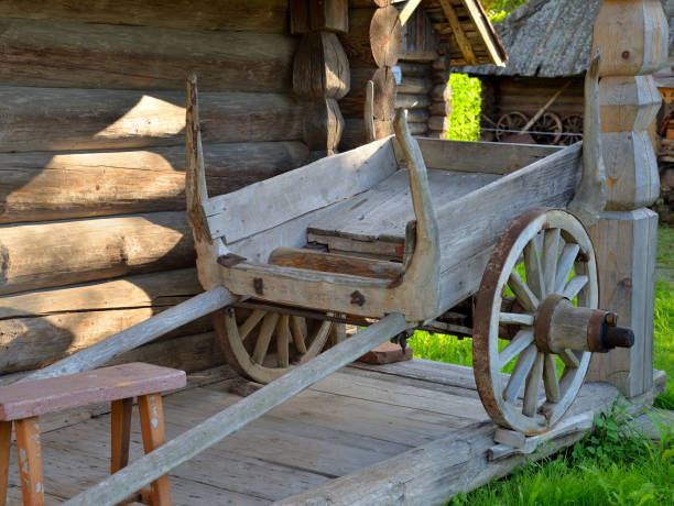 istock Old wooden cart by log shed 1292273996