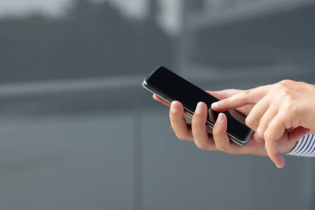 istock Close-up of man using mobile phone. 1292274568