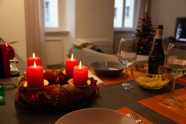 Christmas table with  red decorations in a cozy room