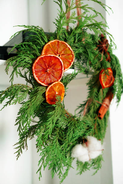 istock close up selective focus juniper wreath with dried orange, cinnamon sticks and cotton 1292276935