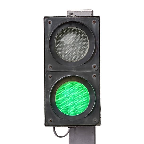 istock Two-color traffic light with green light on it isolated 1292281290
