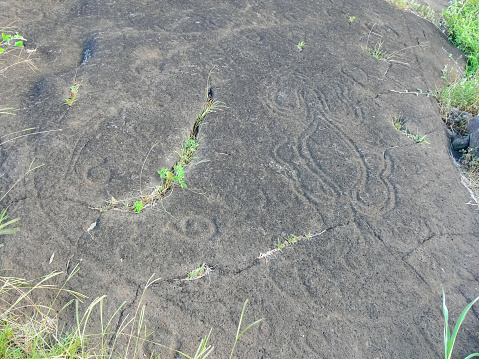 Stone slabs with drawings on Easter Island. Traces of stone processing on plates.
