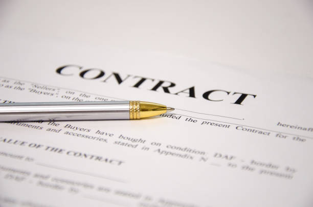 istock the pen is on the contract and the contract is on a white background 1292290307