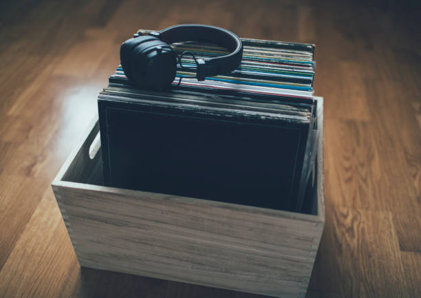 istock Headphones on stack of the vinyl records collection 1292296286