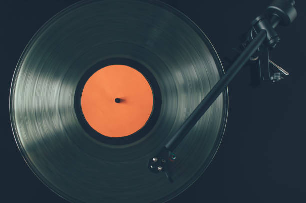 istock Close up of turntable tonearm playing vinyl record 1292296447