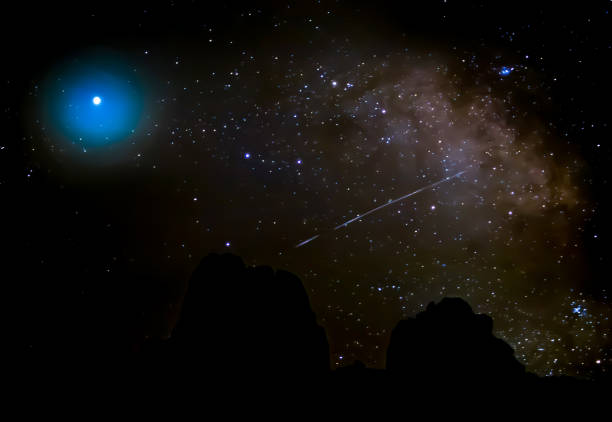 istock Milky Way with Comet and Stars and Black Mountains on Horizon 1292301387