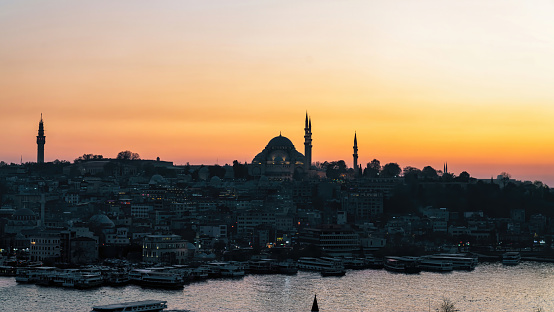 Istanbul, Turkey - December 2019: Sunset in Istanbul Turkey with Suleymaniye Mosque, Ottoman imperial mosque. View from Galata Bridge