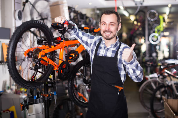 istock Artificer is working with bicycle's brakes 1292301664