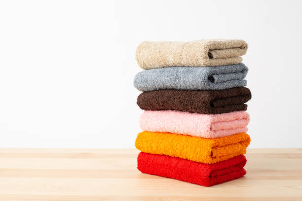 istock Stack of colorful towels on wooden table. 1292302569