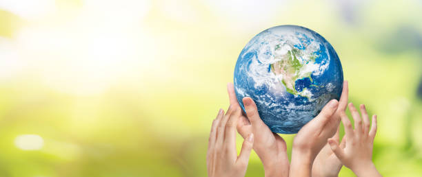 istock Earth globe in family hands. World environment day 1292303338
