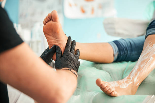istock Focused photo on massagist doing foot treating procedure 1292304485