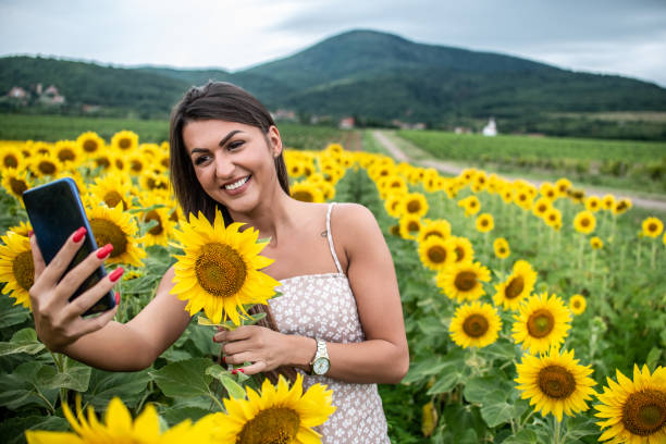 istock A beautiful girl in a sunflower field 1292306464