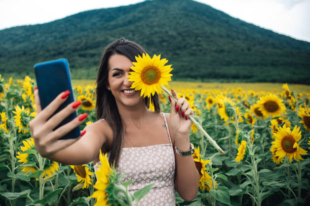 istock A beautiful girl in a sunflower field 1292306497