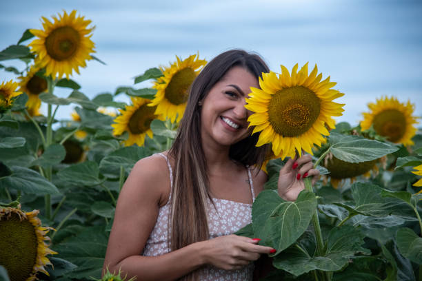 istock A beautiful girl in a sunflower field 1292307251