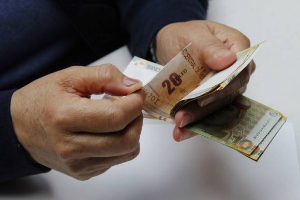 istock economy and finance with Peruvian money 1292307573