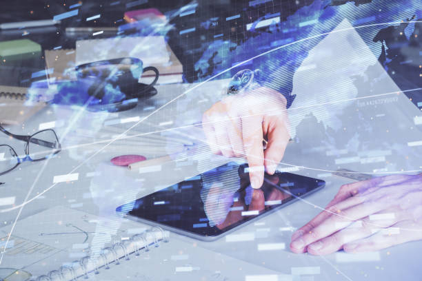 istock Double exposure of man's hand holding and using a digital device and data theme drawing. Technology concept. 1292310772