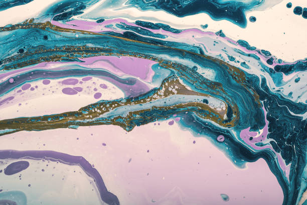 istock Turquoise waves and lilac bubbles mix with golden waves. Fluid Art. Marble effect background or texture 1292315480
