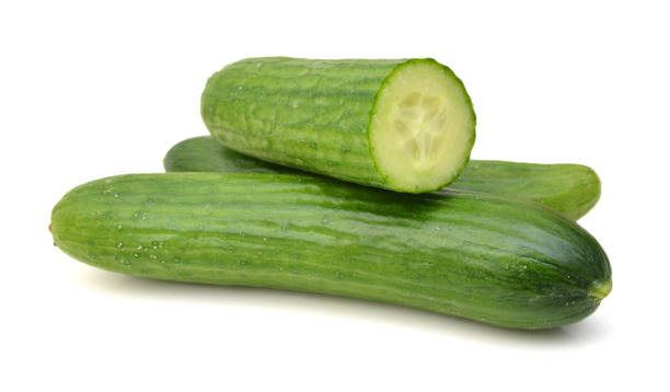 istock Fresh cucumber slices isolated on white background 1292319495