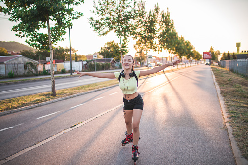 Girl is Having a Fun in Park on Roller Skates